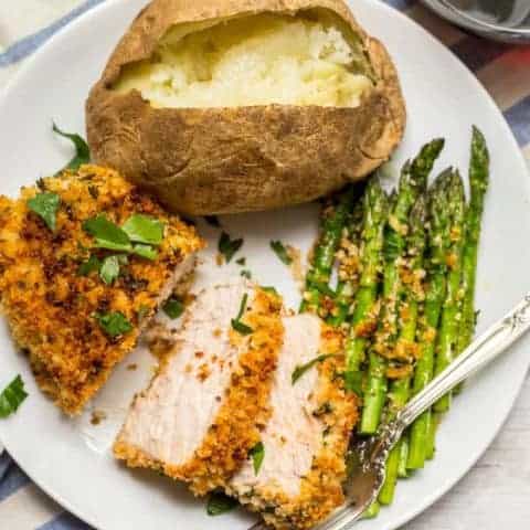 Crunchy baked pork chops are coated in a breadcrumb and Parmesan mixture then put in the oven for an easy, hands-off dinner that’s sure to be a family favorite! | www.familyfoodonthetable.com